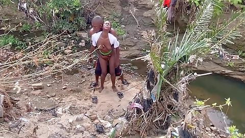 Ebony woman is in the stream and fucked by a big dude