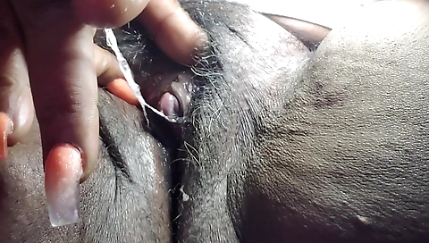 Ebony mature chick in black dress makes homemade porn video