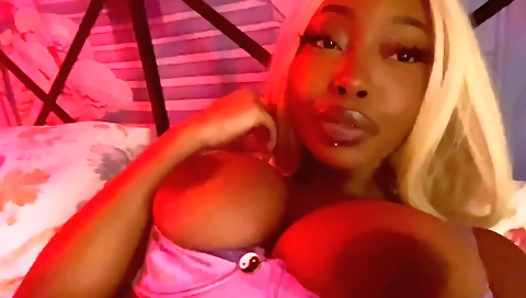 Ebony woman finger riding a toy and reaching orgasm