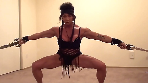 Ebony bodybuilder babe is giving a blowjob to herself