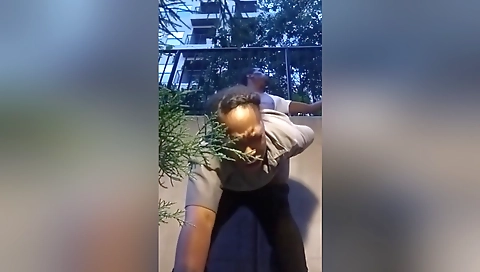 Amateur blonde in black bikini and stockings in the park