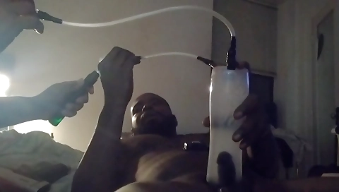 Ebony beauty in a black t-shirt plays with her new smoke chamber