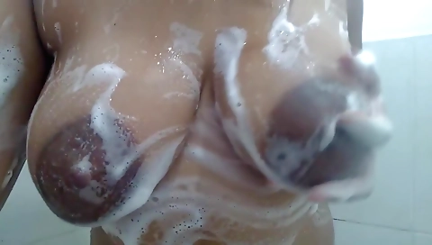 A big tits ebony slut shows off her pussy in the shower