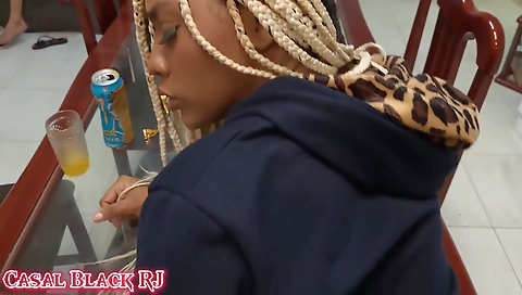 Sexy blonde babe with a nice body shows her tits on the table