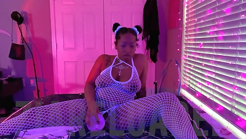 Sexy black chick is filling her pussy with a giant toy