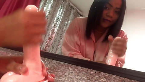 I'm playing with a pink toy in my amateur webcam video