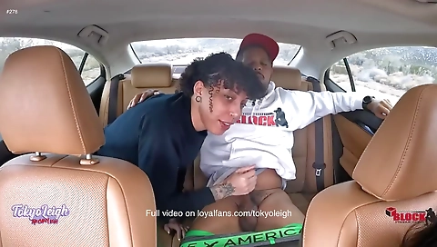 I'm with a black man in my black car and I'm getting a handjob