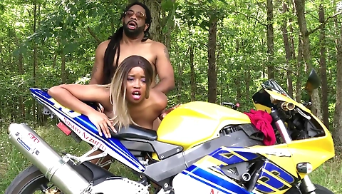 Ebony girl rides on a big dick outdoors in the street