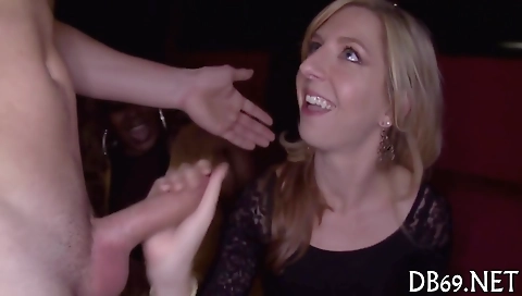 Ebony women and blondes sucking a huge black dick in a group sex video