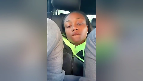 Ebony chick riding her black car in joburg parking lot