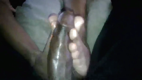 Ebony babe gets her feet fucked in a foot fetish video